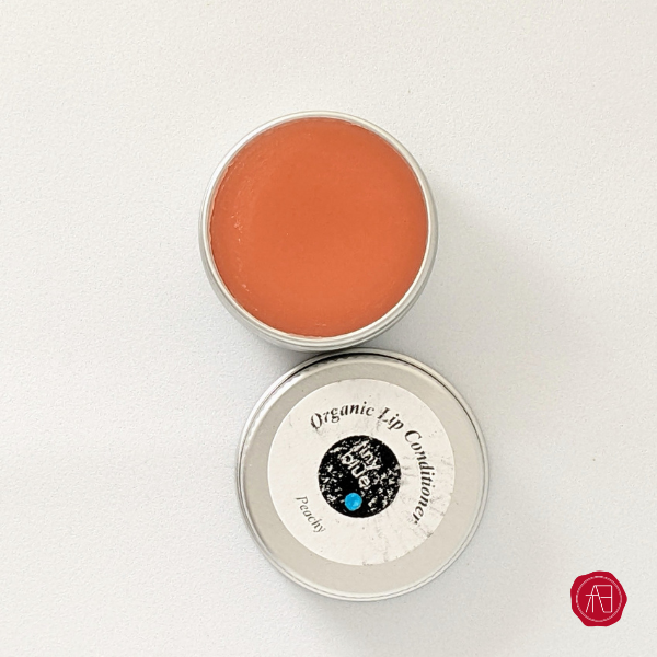 Tinted organic lip conditioner by TinyBlueO for Arthly box
