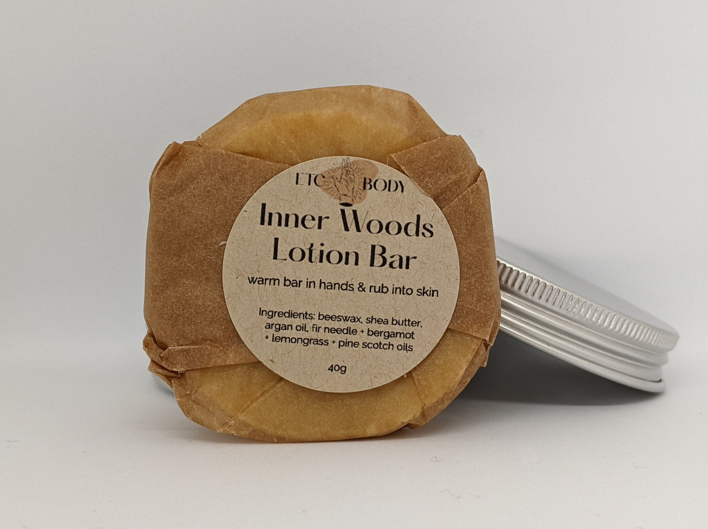 Inner Woods Lotion bar with pine scotch oils. Warm bar in hands & rub into skin.
